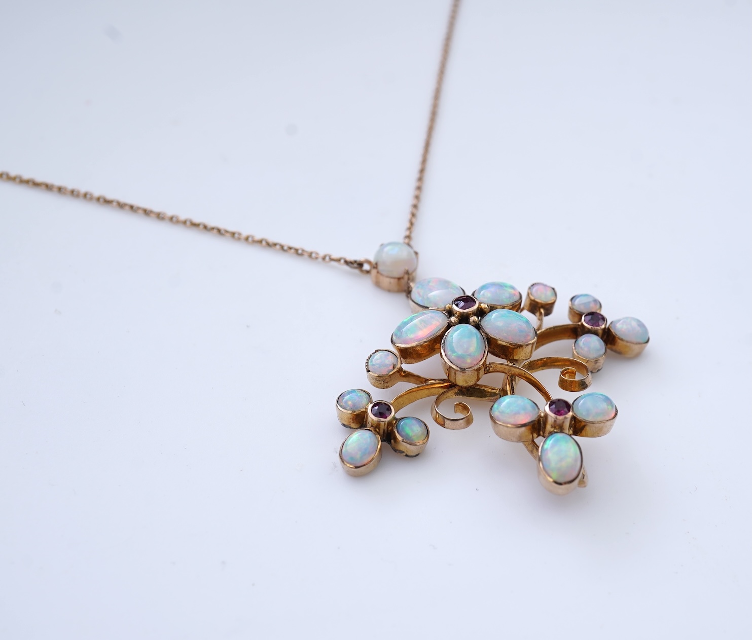 An opal and garnet pendant necklace, circa 1900